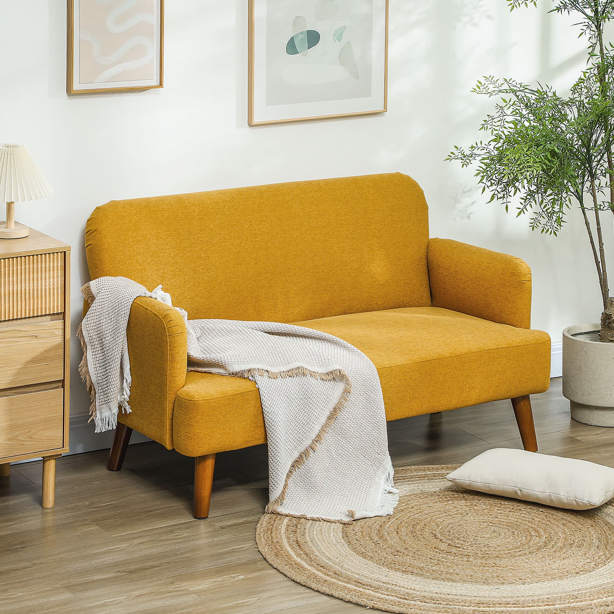 A compact mustard sofa with mid-century legs and generous cushioning - image 4