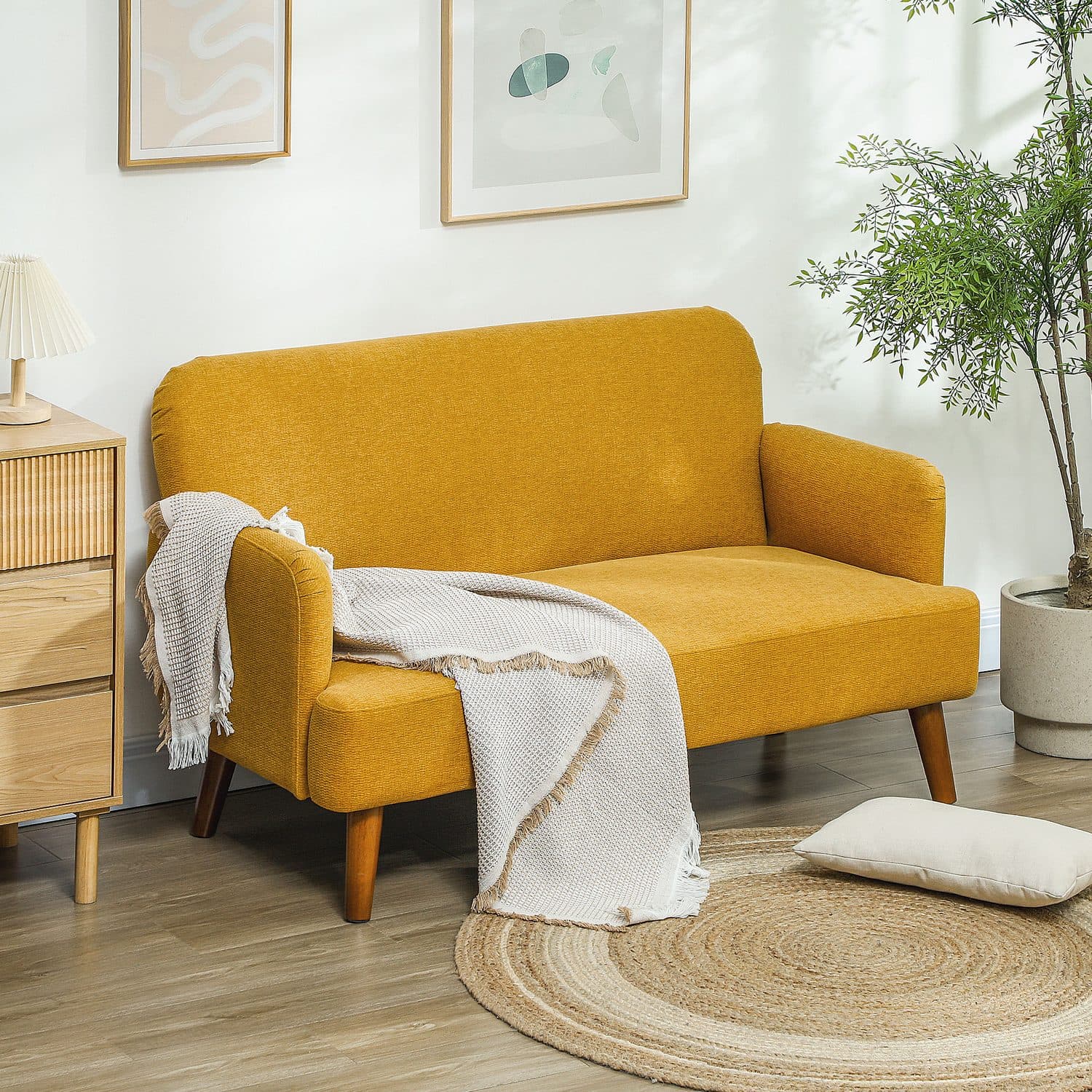 A compact mustard sofa with mid-century legs and generous cushioning - image 4