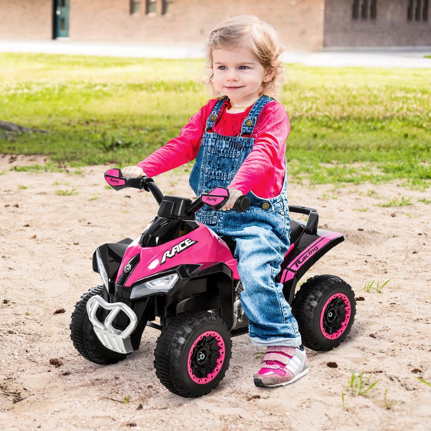 A bright pink quad ride-on for toddler play - image 1
